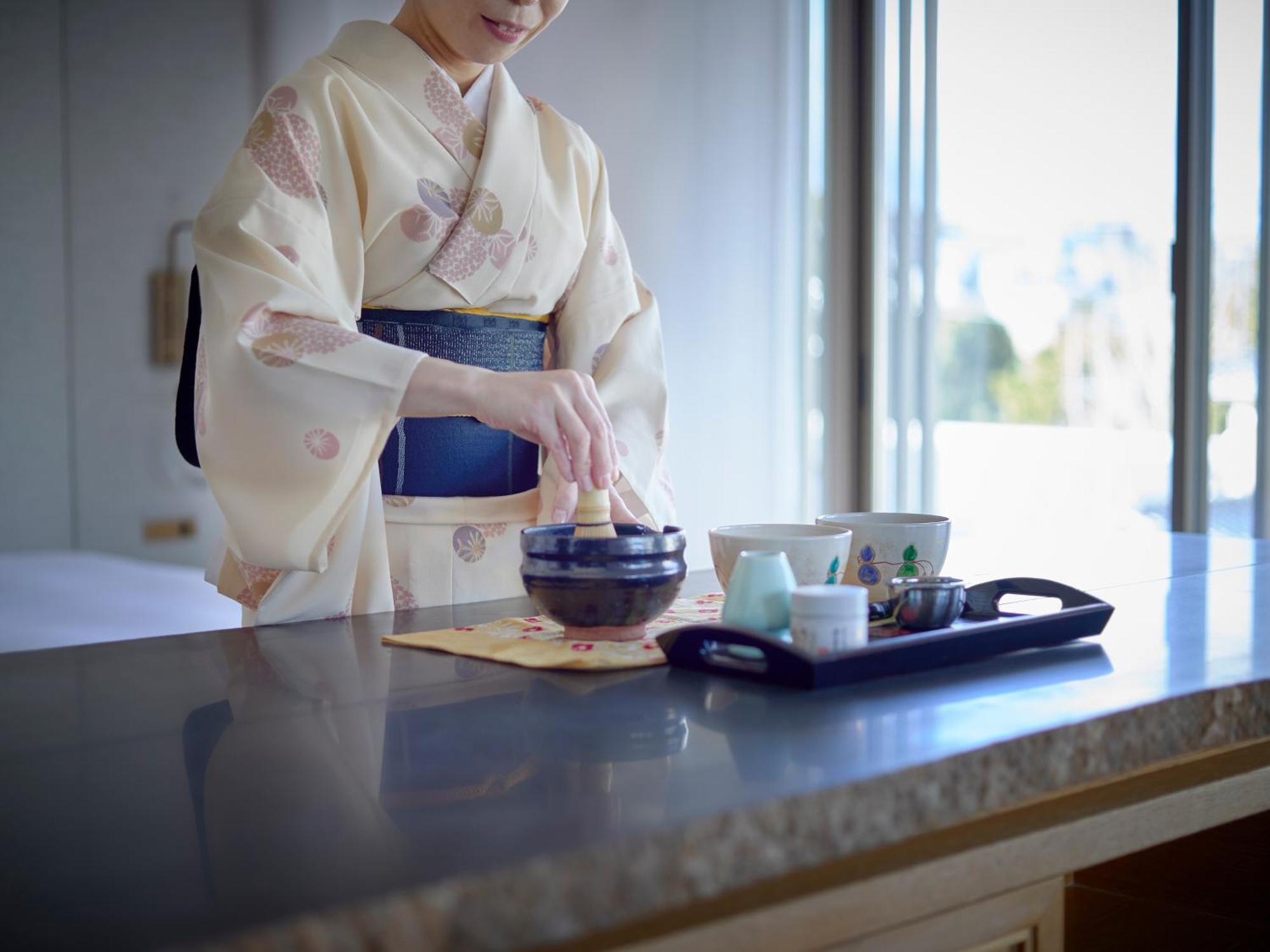 Hotel The Celestine Kyoto Gion Εξωτερικό φωτογραφία A woman in a yukata preparing a Japanese tea ceremony